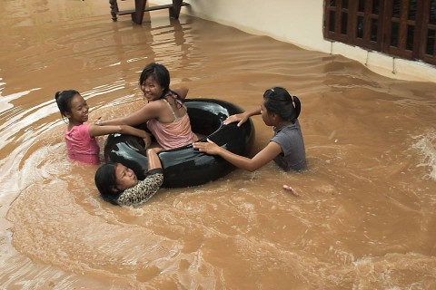Children playing in flood waters